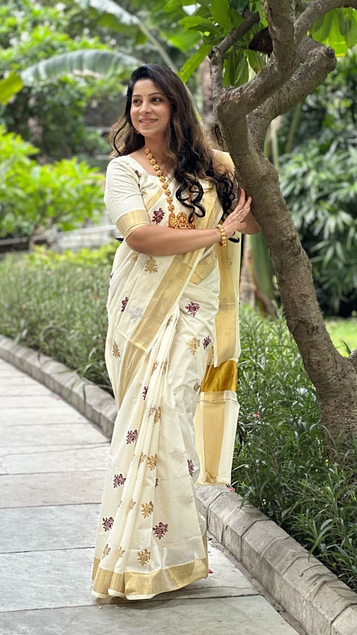 Kerala off-white with zari handwoven and hand painted floral designed saree